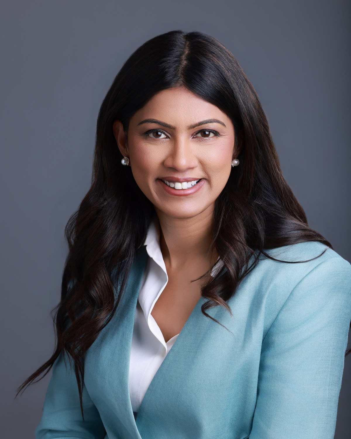 Portrait of Dr. Sonal Patel smiling in a teal blazer